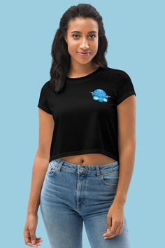 Our magical genie print crop tee is the perfect way to spread some optimism! Express yourself in a burst of colour with this eye-catching cartoon genie crop top made especially for free spirited young ladies. Now you can bring the power of the genie to your every day wardrobe. Never rub a lamp the wrong way again with our magical genie. Durable and stretchy it'll fit you comfortably like a glove, this is because it's made from 95% polyester and 5% elastane. So you don't need to worry about having three wishes granted for a wardrobe malfunction.  You'll feel comfy, stylish and make a wish that this crop tee is always in your summer wardrobe for festivals, raves and more. Production and shipping information: Before our fabulous genie print top gets posted to you it goes through a 2-5 day pro Blue Graphic Print Crop Top T-shirt, Blue Graphic Print Crop Top, Blue Cropped Graphic Tee, Blue Graphic Tee Crop Top, Blue Graphic Crop Top T-shirt, Blue Cropped T-shirt For Streetwear, Ceremonial Clothing, Mythical Creature, Grown Women