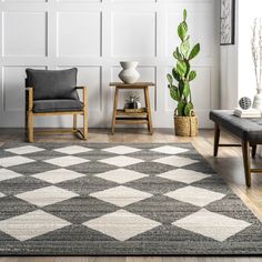 a living room with two chairs and a rug