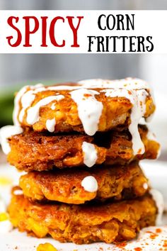 corn fritters stacked on top of each other with white sauce drizzled over them