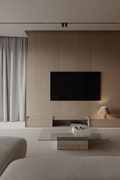 a large flat screen tv mounted to the side of a wall in a living room