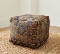 a large ottoman sitting on top of a rug