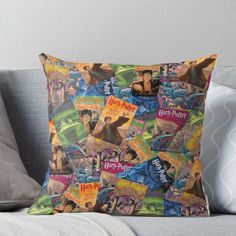 harry potter throw pillow on a couch with the hogwarts movie posters all over it