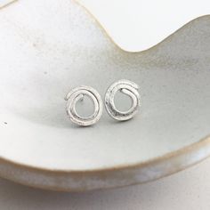 "Our range of hand made silver earrings.  Size of the studs is 9 mm.  This tactile sterling silver earrings hand-made, are the perfect complement for a stylish modern look.  They are an eye-catching pair of earrings which main focus is the simplicity.  ** The piece in the image is not the exact one that you will get, but it will be the same design. Note that there may be slight variations due to the nature of handmade.**  *All items of Jewellery purchased from \"Carmen Palop Designs\" come ready Minimalist Silver Spiral Earrings, Wire Craft, Meme Design, Square Stud, Wire Weaving, Silver Jewelry Handmade, Creative Jewelry, Ear Jewelry, Silver Earrings Studs