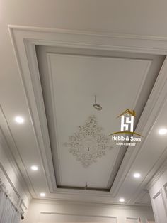 the ceiling has been painted white and is decorated with an intricate pattern on it's surface