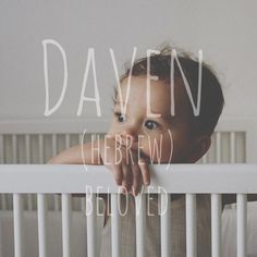 a baby in a crib with the words david hebrew below it's head