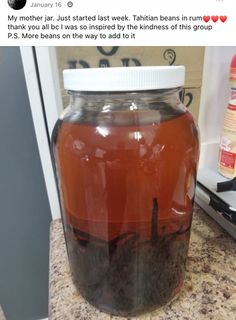 a jar filled with liquid sitting on top of a counter