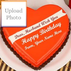 a heart shaped birthday cake on a plate