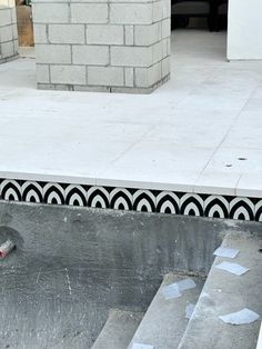 a man riding a skateboard down the side of a cement ramp