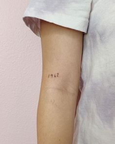 a person with a small tattoo on their arm