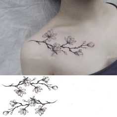 a woman's chest with flowers on it and the bottom half of her neck