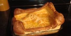 an omelet in a glass dish on top of the stove, ready to be cooked