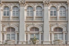 an old building with many windows and balconies