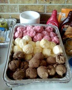 there are many ice creams in the pan on the counter