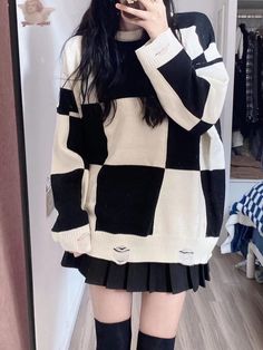 Step up your fashion game with our uniquely designed checked pattern sweater. This eye-catching piece showcases a bold black and white checkerboard pattern, perfect for making a statement. The sweater is crafted with attention to detail, featuring cinched cuffs and hem to provide a snug, comfortable fit. Adding to its distinctive style, the sweater includes a hollow-out distressed design that offers a trendy, edgy look. Ideal for those who love to stand out, this sweater is both chic and versatile.   Please note, the price is for one sweater only. SizeMLLength7075Sleeve Length4648Bust6971Shoulders2223 Gothic Sweater Outfit, Black And White Sweater Outfit, Gothic Sweater, White Sweater Outfit, Steampunk Fashion Female, Steampunk Fashion Male, Gothic Skirts, Checkerboard Pattern, Pattern Sweater