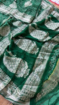 Green Shiffon Zari Banarasi Weaving saree, crafted in a traditional pattern, is a timeless piece of fashion that captures the essence of Indian culture and heritage. Especially during festive occasions like Karwa Chauth and Diwali, red sarees hold significant importance, symbolizing marital bliss, prosperity, and joy. This saree is not just an attire but a statement of elegance and good fortune. In this article, we will dive into the rich heritage, unique features, and styling tips for the WineS Indian Culture And Heritage, Red Sarees, Saree Bandhani, Zari Saree, Designer Sari, Fast And Pray, Old Symbols, Saree Designer, Traditional Pattern