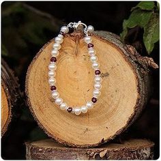 Pearl and Birthstone January Garnet Bracelet. Beautiful pearls, sparkling sterling daisies and genuine garnets mingle together to in this gorgeous bracelet to celebrate her birthday. ♥ Little Girl's Pearls

https://littlegirlspearls.com/blogs/articles/january-garnet-birthstone Garnet Birthstone Jewelry, Julie Miller, January Baby, Garnet Birthstone, Pearl Bracelets, Garnet Bracelet, Birthstone Bracelet, Royal Princess, January Birthstone