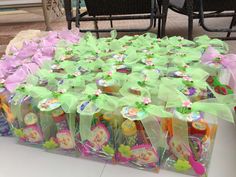 several bags filled with candy sitting on top of a white table next to each other