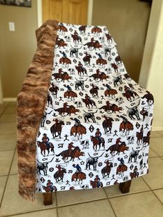 a horse themed chair cover sitting on top of a tile floor