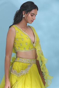 Dance the night away at sangeet and weddings in this charming bright yellow embroidered lehenga with dupatta. Shop designer lehengas in USA from Pure Elegance.