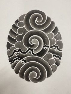 an intricately designed piece of art on the side of a white paper sheet with black ink