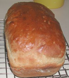 a loaf of bread sitting on top of a cooling rack