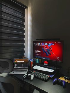 a desktop computer sitting on top of a desk next to a keyboard and mouse in front of a window