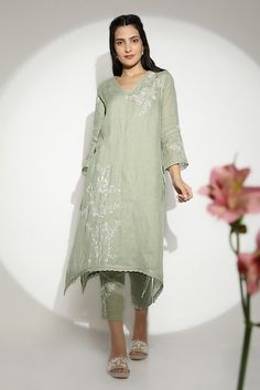 Sage green anchor thread hand embroidered tunic featuring 3D embossed gold petal floral work. Paired with a pant. - Aza Fashions Elegant Resham Embroidery Tunic For Spring, Spring Straight Kurta With Tonal Embroidery, Green Floral Embroidered Tunic For Spring, Spring Green Tunic With Chikankari Embroidery, Green Chikankari Embroidery Tunic For Spring, Green Chikankari Embroidered Tunic For Spring, Floral Tunics For Women, Hand Embroidered Tunics, Anchor Threads