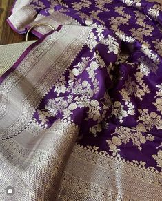 Banarasi uppada fits any and every occasion around the corner, be it formal or informal gatherings. This Silk saree has adorning motifs that are gracefully connected. Katan Uppada is light and soft in texture, associating regal efficacy. PRODUCT DESCRIPTION Fabric - Pure Katan Silk  Technique - Cutwork Color - Purple Maintenance - Dry Wash Only NOTE This is a hand-woven saree so there might be some irregularities, but that is what makes a banarasi saree unique.  The color of the product you see Purple Banarasi Saree, Katan Saree, Golden Saree, Purple Silk, Asian Outfits, Banarasi Sarees, Handloom Saree, Cut Work, Purple Color