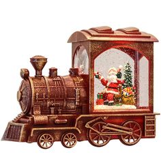 an old fashioned christmas train with santa on it