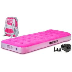 the inflatable mattress is pink and has two backpacks on top of it