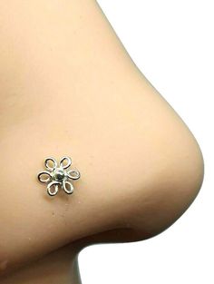 Plain Flat Filigree Flower 22g (0.6mm) 925 Sterling Silver Ball End Nose Stud Bone Simply one of the most popular nose studs we have on sale.    Great as an every day stud that will accent your nose. .............. Your item is 100% Sterling silver and may tarnish as all silver does. It is well known silver reacts with the elements this may be caused by  highly acidic perspiration or contact with other chemical agents  like perfume, makeup, hairspray or cleaning products. The only metal that doe Unique Nose Rings Studs, Flower Nose Ring, Flower Nose Stud, Metal Gauge, Unique Nose Rings, Nose Studs, Nose Ring Stud, Nose Stud, Body Jewellery