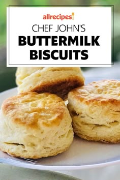 three buttermilk biscuits on a plate with the title above it reads, chef john's buttermilk biscuits