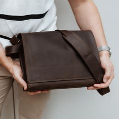 This Brown Leather Messenger Bag is exactly what you've been looking for. Spacious enough to carry everything you need for the day, yet still comfortable to wear. It can be styled as a Shoulder Bag or a Cross-body Bag, depending on your preference. Designed with a special pocket for a 13-inch Macbook (2023-2024) or iPad, this bag also features an adjustable leather shoulder strap for added comfort. Its shape and opening allow for flexible storage and easy access. We take pride in our attention t Brown Leather Messenger Bag, Messenger Bag For Men, Mens Bag, Messenger Bag Leather, Thoughtful Gifts For Him, Leather Laptop Bag, Personalised Gifts For Him, Messenger Bag Men, Mens Leather Bag