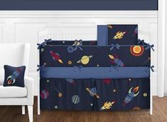 a baby crib bedding set with space theme