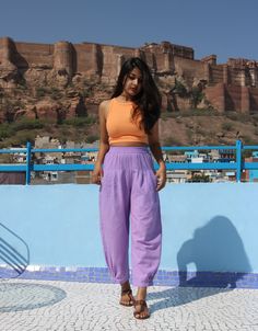 "Custom made baggy pants for women, Lilac linen pant, Bohemian pants, Made to order, Plus size Perfect for summer days.. goes well with cropped top.. Comfy baggy pants.. -Model height: 5'3\" wearing size S -Length: 36\" -Fit: Comfortable -Closure: Elasticated waist You can style these linen pants with casual tops or our tank tops. You would want to wear these everyday!" Purple Linen Pants Outfit, Baggy Linen Pants Outfit, Lilac Pants Outfit, Purple Shorts Outfit, Big Pants Outfit, Momma Outfits, Purple Pants Outfit, Linen Pants Outfit Summer, Trousers Outfit Casual