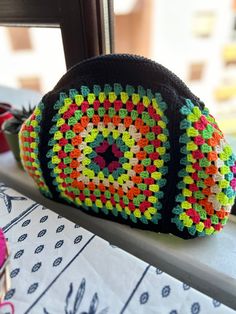 A colorful Granny Square Crochet clasp clutch bag is a versatile and fashionable accessory that can be used as both a clutch and a crossbody bag. 🧶 The bag features a clasp closure to keep your belongings safe, and a detachable strap that allows you to wear it as a crossbody bag for hands-free convenience.🛍 Whether you're going out for a night on the town or running errands during the day, this colorful Granny Square Crochet clasp clutch bag is the perfect accessory to complete your look 📍30x Handmade Multicolor Crochet Clutch Bag, Multicolor Crochet Bag With Removable Pouch For Daily Use, Colorful Handmade Pouch Shoulder Bag, Rectangular Crochet Clutch For Daily Use, Multicolor Crochet Pouch Bag, Everyday Use Crochet Rectangular Clutch, Multicolor Mobile Phone Pouch, Handmade Multicolor Clutch Shoulder Bag, Handmade Multicolor Clutch For Everyday Use