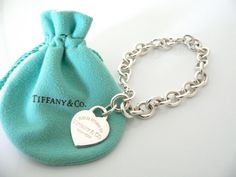 Overview:Offered for sale is a wonderful and mint Tiffany and Co.  Sterling Silver "Return to Tiffany" Heart Tag bracelet - in a rare and hard to find longer length - 8.5 Inches.   The piece is  made from substantial and bright Tiffany silver, and yet retains a very  feminine feel to it.   It is a classic Tiffany piece that will most  certainly be a piece that you will be used over and over again, so it is  great value for the money!  It is a wonderful piece that fits a  lifestyle on the go -- t Kate Middleton Jewelry, Tiffany And Co Bracelet, Tiffany And Co Jewelry, Tiffany Bracelets, Return To Tiffany, Heart Tag, Tiffany Jewelry, Funky Jewelry, Silver Charm Bracelet