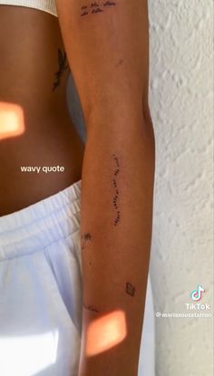 a woman's arm with writing on it