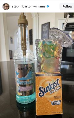 a bottle of sunskift sitting on top of a counter next to an empty box