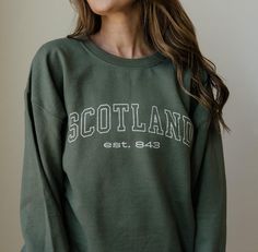 Wrap yourself in the comfort and elegance of our Scotland Unisex Sweatshirt. Crafted from premium quality cotton and polyester blend, this sweatshirt feels incredibly soft against your skin while ensuring durability. Available in a range of sizes from small to XXL, it offers a relaxed fit that suits all body types. Perfect for keeping warm during chilly winter days or layering for extra comfort, this sweatshirt is an everyday essential. The subtle, yet striking, Scotland-themed design gives a nod to the rich cultural heritage of Scotland, making it not just a piece of clothing, but a tribute to tradition. Whether you're exploring the landscapes of Scotland or enjoying a cozy night in, this sweatshirt is your go-to for both style and comfort. The vibrant colors and intricate patterns make i Scotland Souvenirs, Semi Formal Outfits, Travel Clothing, Travel Wear, Winter Days, Formal Outfit, Winter Wear, Travel Gifts, Travel Outfit