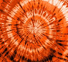 an orange and black tie dyed background