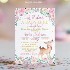 a baby shower is shown with confetti on the table and pink flowers around it