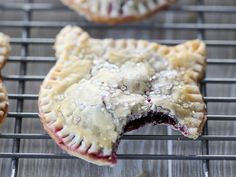 several small pies on a cooling rack