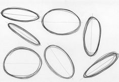 a pencil drawing of different shapes and sizes of ovals on a sheet of paper