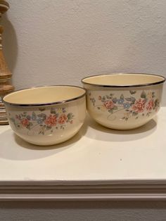 two bowls sitting on top of a white counter