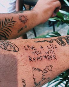 two people with tattoos on their arms that say live a life, you will remember