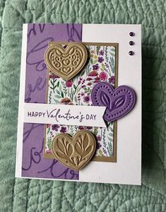 a close up of a greeting card with two hearts on it and the words happy valentine's day