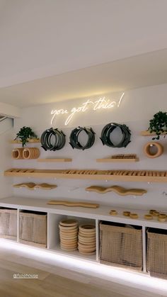 there are many different types of items on the wall in this room, including baskets and plates