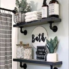 a bathroom with two shelves holding various items