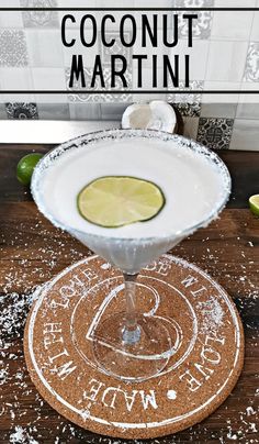 a margarita cocktail sitting on top of a wooden table